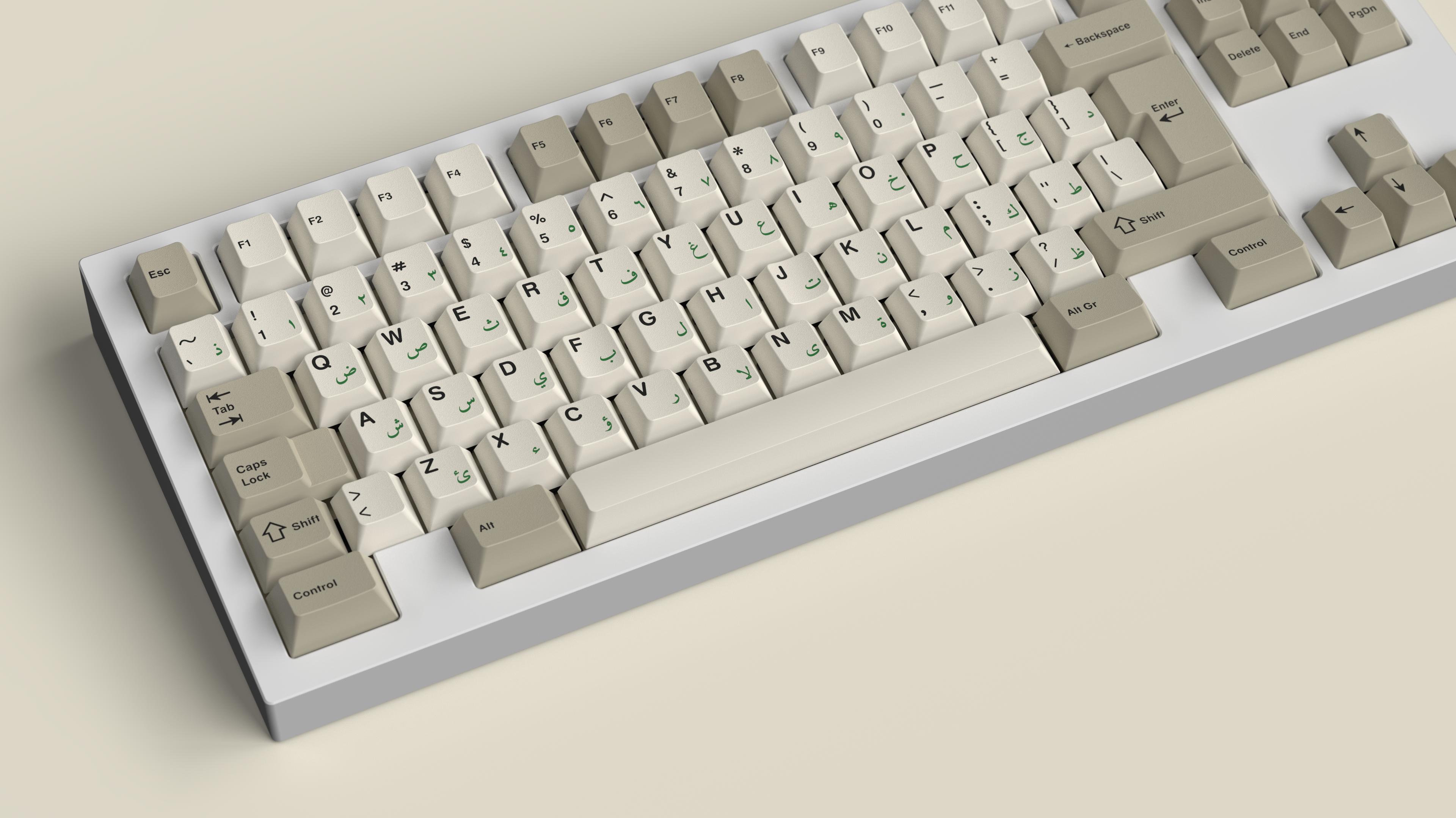 silver keyboard with beige arabic/english keycaps