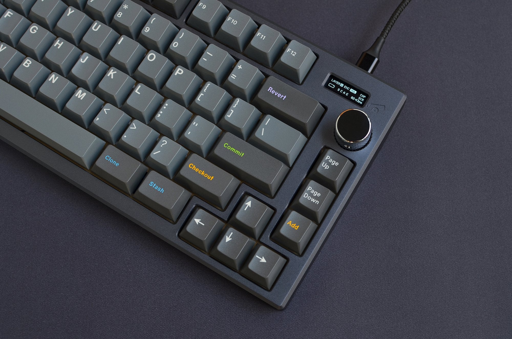 Grey keyboard with grey keycaps and a rotating knob